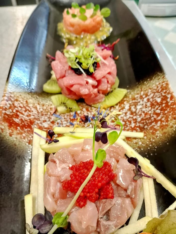 Germogli e frutta nei piatti dello Chef Colletti.